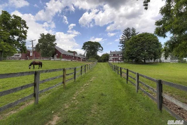 19.77 Acres! **View Amazing Video.** 3 Lot Subdivision Potential! Zoned-5 Acres. Exciting Equestrian Estate - Manor With Four Houses (3 Bedroom, 2 Bath, 3 Bedroom-1.5 Bath, 3 Bedroom, 1.5 Bath, 2 Bedroom-1 Bath), On Amazing Horse Property, 15 Stall Barn, 2 Additional Barns & Several Corals Adjoining Golf Course & Country Club. Choice Of Jericho Or Locust Valley Schools.