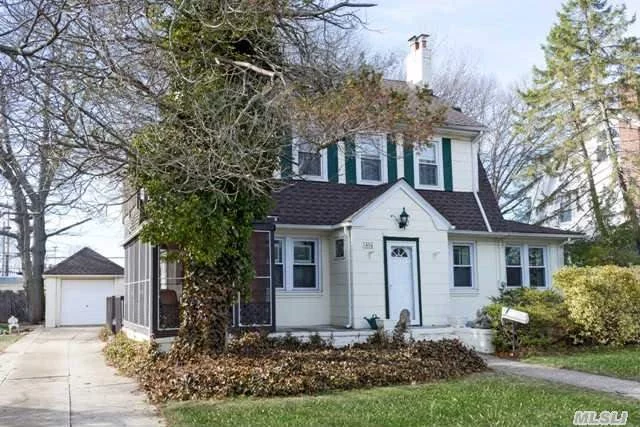 Stately Charming Colonial On Oversized Lot With Beautiful Yard, Enclosed Porch, Garage Parking For 4 Cars. Lovely Lr W/Fp And Great Spaces For Entertaining. New Roof And Redone Baths.