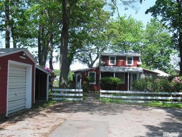 Lovely Cottage On Marion Lake, High On The Bluff On Western Side W/ Sweeping Views East. 4 Bed, 1 Ba Living Room W/ Fireplace & Hardwood Floors . Wonderful 3-Season Sun Porch Along South Side. Separate 2-Car Garage Would Make A Perfect Studio Or Workshop.