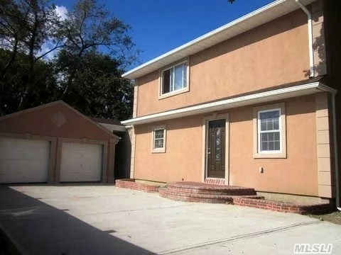 Stunning Renovated Colonial On Quiet Tree Lined Street Features New Granite Kitchen With Cherry Cabinets, New Fully Tiled Baths Architectural Roof, New Stucco Siding, New Brick Porch And Patio, Huge 2 Car Garage, Nice Large Lot!