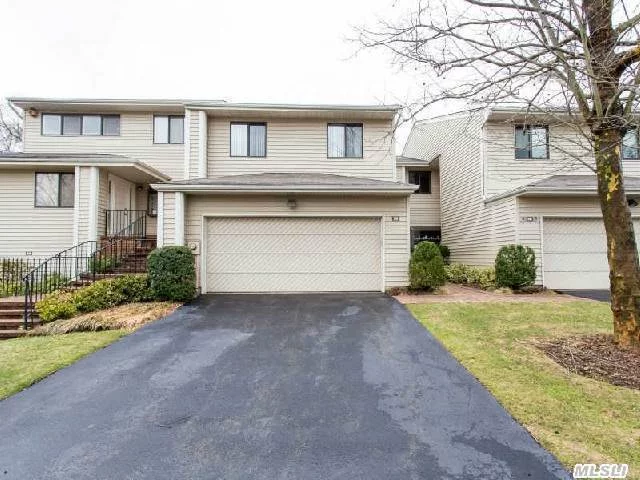 Beautiful Aspen Model In Desirable Woodbury Greens - Perfectly Located With Views Of Woods And Pond From Large Deck, Three Floors Of Living, Syosset #2 School District, Community Pool And Tennis, Alarm, 3 Zone Heat And Cac, Central Vacuum, Fully Finished Basement And Garage. Priced To Sell - Lowest Priced Unit In The Community!