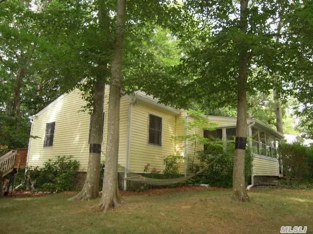 Best Of Both Worlds: A House In The Woods-But Walk To A Private Deeded Beach! Full Gut Renovation In 2006. Home Has Open Floor Plan W/Cathedral Ceiling, 3 Brs, Bath, Stainless Steel Appliances, Lg Deck Overlooks Yard & Woods, Enclosed Front Porch, Cac, Hardwood Floors, Anderson Windows, New Roof & 10X14 Shed W/Electric. Great Weekend Getaway Or Year Round Home.