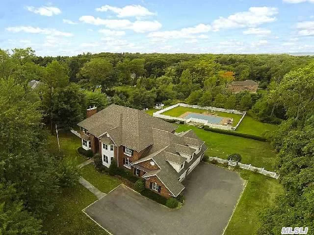 **18% Reduction Will Bring New Taxes For 2015/16 To Approx. $28K/Yr*Easterly Estate: Quintessence Of Gracious Gold Coast Living In This 2002, 5 Bedroom, 4.5 Bath Brick Colonial Situated On 1.85 Acres With Pool And Distant Waterviews. Soaring 2-Story Impressive Sun-Lit Entry Foyer And Open Floor Plan Extend To A Three Car Garage, Rear Stairs And First Floor Guest Room.