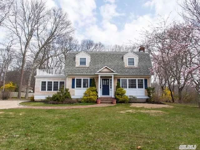 Charming Cedar Shake Dutch Colonial, Living Room With Wood Burning Fireplace, Updated Kitchen, Sunroom, And Second Story Deck With Views Of East Creek. Lovely Property Abutting Preserved Land. Modern Move In Condition. Complete Renovation In 2005.