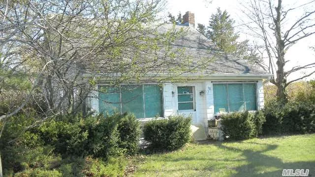 Cute North Fork Style Cape Home In A Farmland Setting! Hardwood Floors Throughout, Needs Tlc. Detached Garage, Pretty Property. Close To The Beach!
