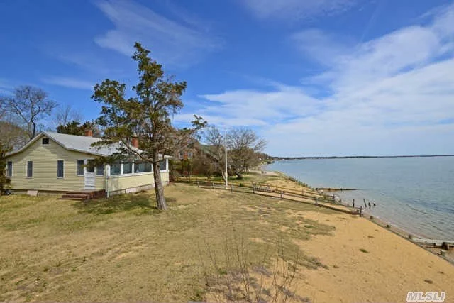 Here Is Your Opportunity To Own A Panoramic Beach Front Home On The Bay! Rarely Found Changing Rooms With Showers Along The Beach Harken To The North Fork 2nd Homes From The 1950&rsquo;S.  Updated Bulkhead And Home Offering Panoramic Views, Even From The Kitchen Sink! Home Offers Updated Heat And Central Air, Wood Floors And Is Ready For Your Personal Touch!