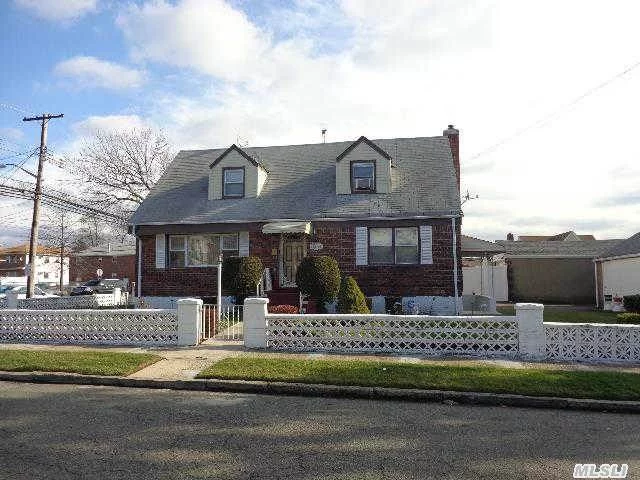 Springfield Gardens; This Brick,  2 Family Cape Is One Of A Kind! Enough Curb Appeal For 2 Houses. This Property Features A Full Finished Basement With Its Own Separate Entrance. Property Features 2 Living Rooms,  2 Dining Rooms,  2 Kitchen,  3 Bedrooms,  2 Full Baths,  & A 1 Car Detached Garage. Surveillance Camera That Covers The Entire Perimeter Of The House.