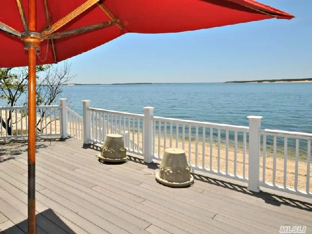 Classic New England Expanded Cape Set On The West Side Of Nassau Point. Situated On An Extra Deep .93 Acre Bayfront Lot With 100&rsquo; Of Bay Beach Overlooking Robin&rsquo;s Island. Be In By Summer.