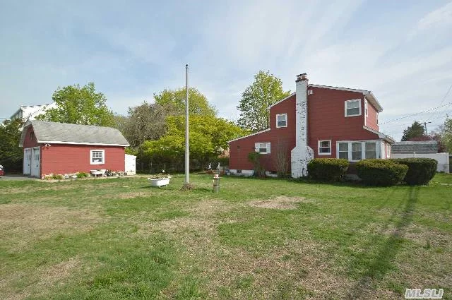 Lovely Colonial Situated On Large Fenced-In Corner Property, Perfect For Gardening Or Entertaining. This Beautiful Home Features A Sun Filled Enclosed Porch And Sun Room That Can Be Used As An Office Or Den With Original Character And Wood Beams. Cooking Gas, Full 2 Car Detached Garage With Storage - Move In Ready.