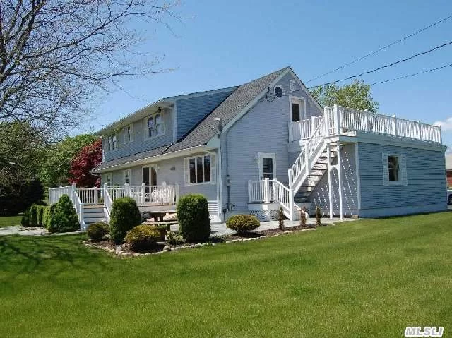 Unwind By The Sea. This Country Cape Is Located On A Shy Acre In A Sound Front Community With Private Association Beach. The Spacious Interior Opens Out Onto A Large Deck That Overlooks Two Stone Patios And A Courtyard Garden. The Floor Plan Includes Four Bedrooms, Two Baths, Living Room, Dining Room, Office, Eat-In-Kitchen, Second Story Deck And Two Car Garage.