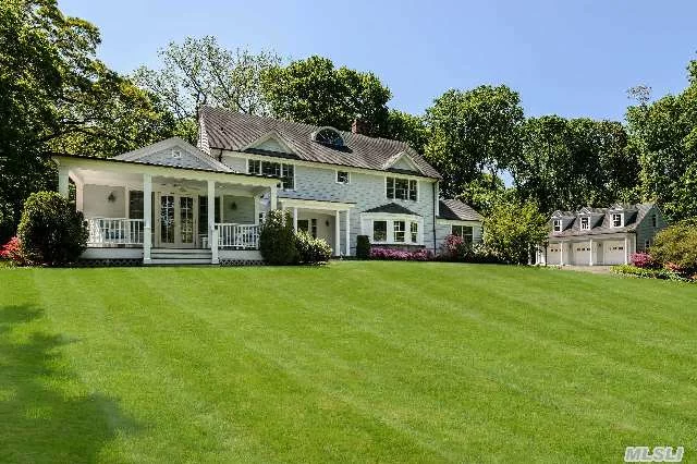 Tucked Away Gem Near Town Of Oyster Bay. Recently Enlarged And Updated This Pristine 5 Bedroom Colonial Offers Every Amenity Including Front And Back Stairs, Whole House Generator And 3-Car Carriage House With Full Basement And Attic. The 2.74 Acre Estate-Like Setting Is Private And Tranquil With Lush Lawns Bordered By Mature Trees.