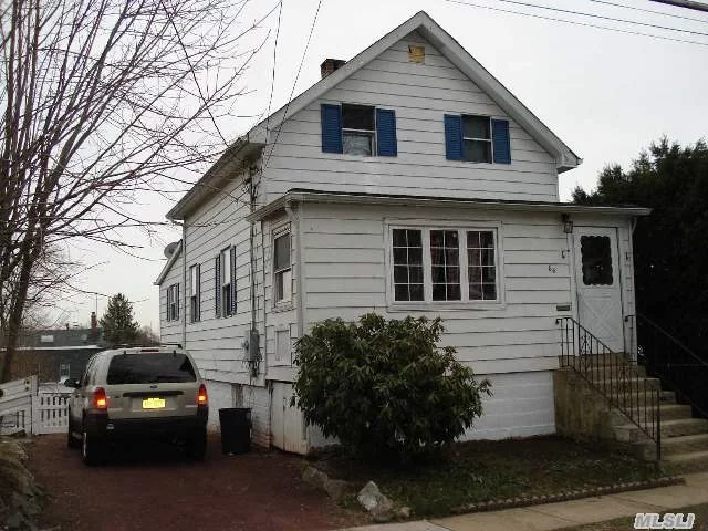 Great Oyster Bay Village Starter. 5 Rooms 2 Bedrooms 2 Baths, Full Walk Out Basement With Additional Bath.Poss M/D With Proper Permits. Walk To All Village Shopping Lirr To Nyc. Small Historic T.O.B. Burial Ground Located In Rear Of Property Maintained By The Town. Gas Heat, New Roof.