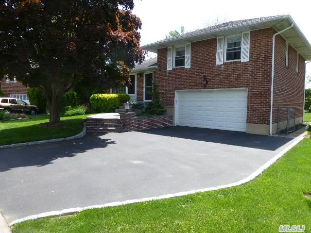 Welcome Home To This Spacious Bright/Sunny Split Set On A Lovely Residential Block Professionally Landscaped W/Curb Appeal,  This Great Home Has Some Updates, Boiler, Deck, Are Just A Few. Cac, Hardwood Floor, Cherry Cabinets In The Kitchen, Great Den, Beautiful Property, Are Just A Few Extra Features Along With Low Taxes In The Syosset Blue Ribbon District.