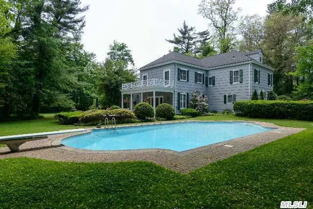 Traditional Colonial With 7 Bedrooms. Beautiful Pool And Terraces. Very Private Property. New Roof, New Gas Heating System, Plaster Walls, All Asbestos Removed, Basement Waterproofed. Pool Resurfaced.Located In The 4 Acre Zoning Area Of Lattingtown.