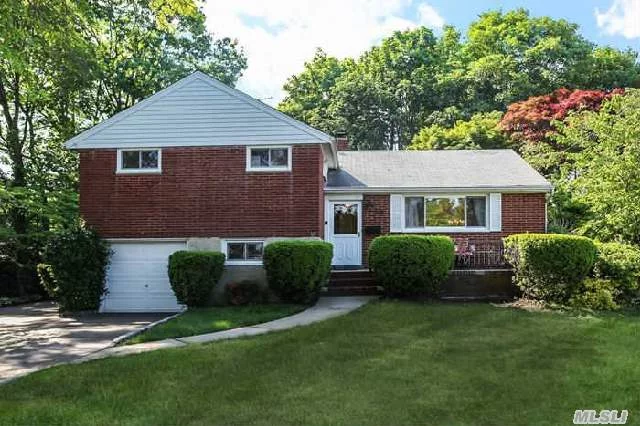 Large Brick Split Level With Large Private Rear Yard & Covered Patio. Hardwood Floors Throughout. Possible Mother/Daughter With Proper Permits. Close To Schools, Lirr And Shopping.