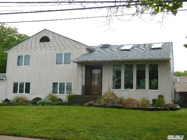 Island Park, N.Y. Harbor Isle Split Style Home Featuring 3 Bedrooms* 2 Full Bathrooms* Bay Views* Great Back Deck For Entertaining* Cathedral Ceilings Throughout* Hardwood Floors* 1 Car Garage* Oversized Property*