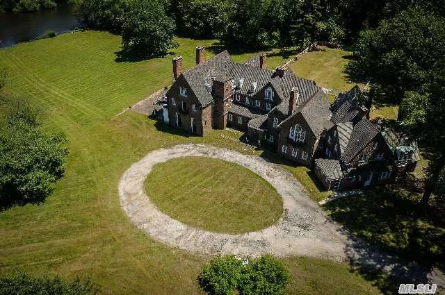 Fabulous H. T. Lindeberg Brick Manor Home Overlooking Large Pond In Lattingtown. Built For Myron C Taylor, Former Chairman Of Us Steel And Us Ambassador To The Vatican, Lindeberg Modeled A Pre-Civil War House With Many Imported Architectural Elements Including A Private Chapel. Opportunity To Restore Or Update This Manor Home Or Build Your Dream House.