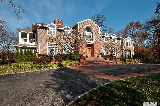 Majestic Colonial Privately Set At The Top Of A Cul-De-Sac On A Private Street. Dramatic Architecture With Towering Ceilings And More Than 6000 Sq Ft Of Living Space. Master Suite Features Private Treetop Veranda