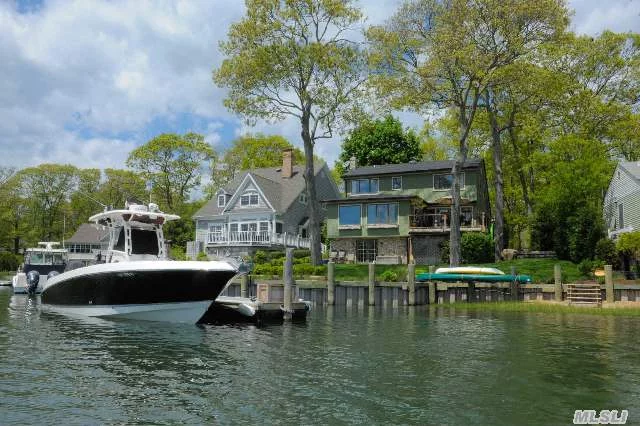 Stunning Waterfront Home In Private Community With Private Dock, Bulkhead. Short Distance To Deeded Private Sandy Bay Beach. Too Many Upgrades To List. A Must See!!