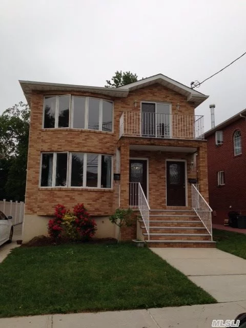 Location! Location!!! Large. Bright 3Br. 2 Full Bath. Balcony. Washer/Dryer. Eik. Hardwood Floor Throughout. Separate Entrance. School District 26. Close To Transportation. Must See!!!
