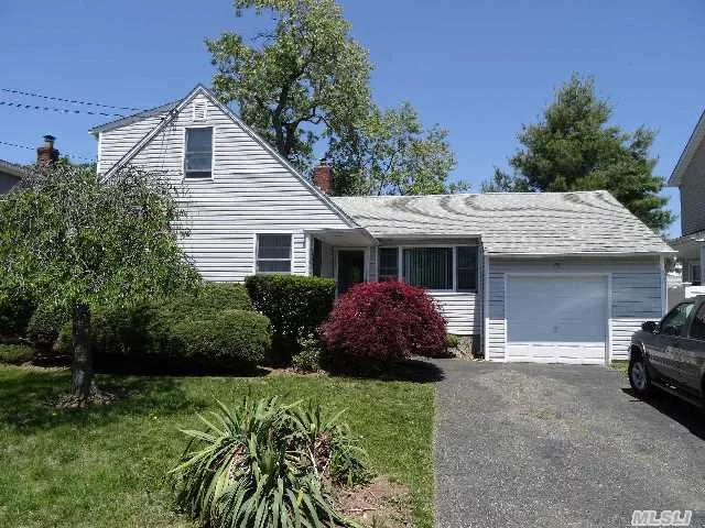 This New Englander Has All New: Andersen Windows/Siding/Front Door/Arch. Roof/Master Bath & Boiler! Wood Floors, Whole House Fan,  Master Br Suite, 21/2 Baths In The House Plus Den Or Office & Bath In Converted Garage.