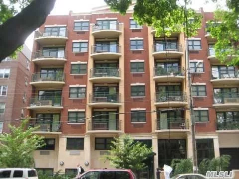 Stunning Mint Very Sunny 2Bed, 2Bath Condo Features Luxury Living W 2 Balconies, Granite Kitchen W Ge App, All Hw Floors, 2 Walk In Closets, Lr Master Suite W Full Bath, 3 Ac Combo Units, Facing South With Bright Sunshine Thru Out. Gym In Building, Parking Spot Included. Close To E/F Subway, Supermarket, Restaurant And All. Must See To Appreciate. Tax Abatement Left