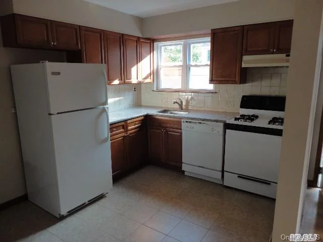 Updated 2 Bedroom Apartment With 1 1/2 Baths, Updated Kitchen Cabinets W/Granite Counter Tops, Hardwood Floors Throughout. Separate Entrance, Off-Street Parking, Near Transportation And Shopping.