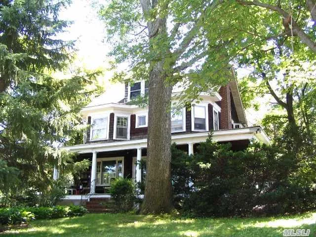 Classic 4 Bedroom Colonial With Front Porch On Huge Flat Lot With 2 Car Garage. Needs A Touch Of Tlc To Return It Back To Its Former Glory!  Walking Distance To Schools, Beaches And Village.