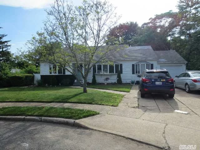 This Split Is In A Quiet Cul-De-Sac With A Side Extension Including Two Rooms And A Full Bath. Rooms Can Be Master Bdrm, Or Extra Bedroom And An Office. Heating System Is Only 2 Years Old. In-Ground Guinite Pool On Oversized Lot. Plainedge Sd #18.