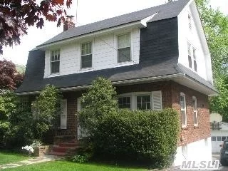 Charming Center Hall Colonial Just 4 Minutes, 2 Short Blocks From The Long Island Rail Road, 3 Levels Of Living, 3+ Bedrooms 2.5 New Marble Baths, Living Room With Granite Fireplace, Huge Eat In Kitchen, Enclosed Screened In Side Porch