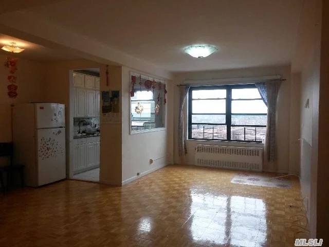 Corner Unit. Face To East & South. Huge 2 Bedroom Apartment In A Part Time Doorman Building. Every Room Has Windows. Beautiful City Views. Ps175 Elementary School Is Right Downstairs. Near Sears, Costco , Central 21 And Queens Center Mall. Walking Distance To R M Train 67 Ave Station. Garage Is In The Basement. Parking Is Available On Waiting List