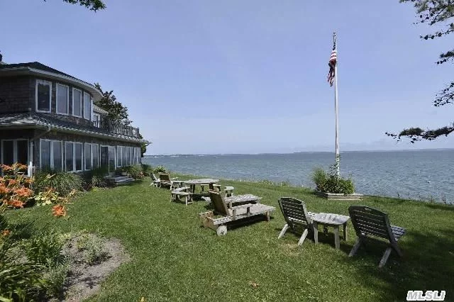 100&rsquo; Of Bayfront On Peconic Bay Blvd. In Laurel. Spacious 4 Bedroom Home With Breathtaking Water Views Throughout The Home. Second Floor Master Suite With Balcony Connecting Den/Office. Sandy Beach With Bulkhead, Studio/Guest Cottage, And Detached One Car Garage. Hardwood Floors Throughout & Cac.