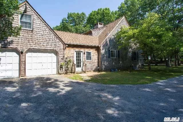 Beautiful North Fork Classic Four Bedroom Cedar Shake Shingled Cape On An Acre Abutting A Nature Conservancy Meadow On Goose Creek. Home Features Include Hardwood Floors, Den With A Brick Fireplace, Formal Dining Room,  2 Car Garage, An Enclosed Breezeway With Washer And Dryer. Great Location With A Water View Over The Meadow Grasses.