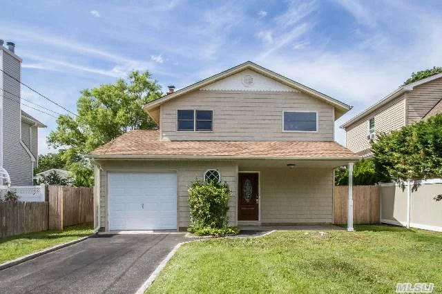 Beautiful 4 Bedroom, 2 Full Bath Colonial. Completely Renovated. New Kitchen With Cherry Cabinets, Granite Countertops & Ss Appliances. New Tiled Bathrooms, Newly Finished Hardwood Floors, New Carpets. New Roof, Siding. Fenced Yard