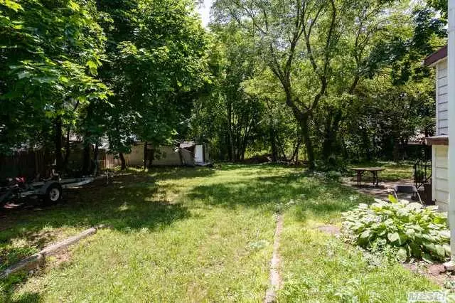 Calling All Builders! Prime 1.34 Acre Lot In Non Flood Zone With Possible 6 Lot Subdivision. Access Points Off Library Lane And Violet.Rd. All Flat Property. House On Property Is As Is Owner Willing To Discuss Partnership Re Financing. Prime Location. Call For Tax Map Showing Possible Subdivision.