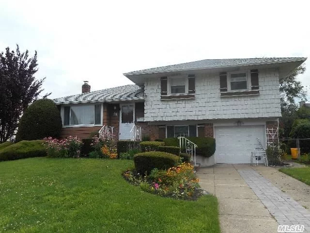 Well Maintained Split At Quiet Residential Location. New Roof (1 Yr),  New Cac, New Paver Walk. Updated Eik W/ Wood Cabinets, New Fl & New Stainless Refrigerator & Dishwasher. Micro As Is. Replaced Windows, Boiler @ 7, Crown Moldings, Hw Fl. Prof Landscaping. Enclosed Patio In Lovely Private Yd. Taxes W/ Star @ 11, 303. Convenient Shopping, Parkways.Sd 21 Must Be Seen!