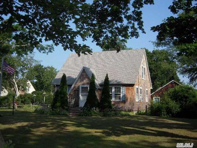 Charming Cape Cod Home With 3 Brs, 2 Baths, Living Room, Formal Dining Room, Eik, Hardwood Floors On 1st Floor Under Carpet And Full Basement. Property Also Features A 2 Car Detached Garage, Cozy Back Deck And Old Fashion Clothes Dryer. New Weil Mclain Burner, Home Was Re-Sided With Cedar Shake Shingles In 2012 And The Roof Is 8 Yrs Young. Close To All.