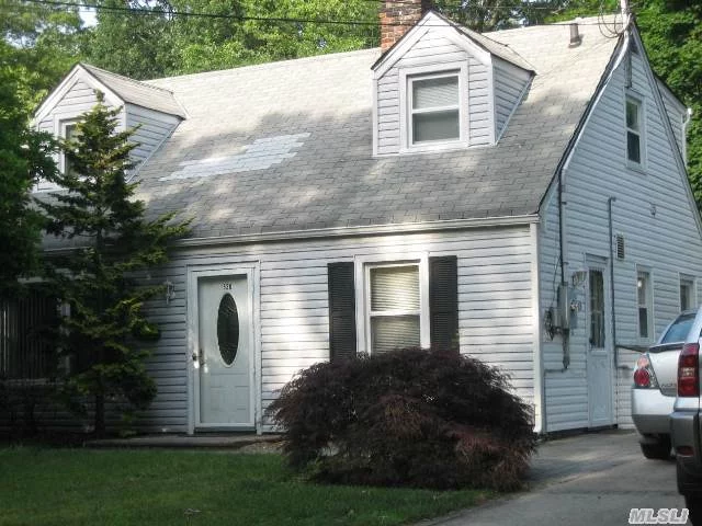 Beautiful Cape Rear Dormered. Vinyl Sided, Updated Kitchen, Baths, Windows, Large Florida Room Off The Back, Brick Paver Patio.