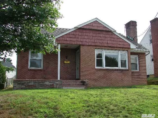 4 Bedroom Expanded Cape. Hardwood Floors, Wood-Burning Fireplace. Great Bones. This Home Is Being Sold As Is.