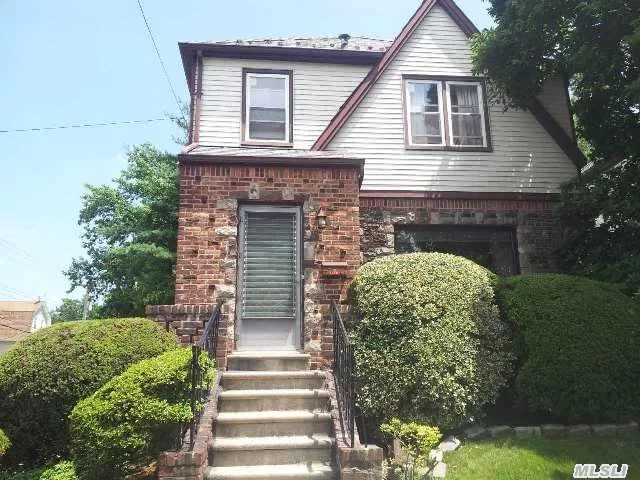 2 Family C.O., 2 Electricity Meters, Convenient To Kissena Park/Golf Course, Wood Floors Throughout, Very Bright/Corner House, Separate Entrance To Basement, Enclosed Den, Great Backyard, Det Garage.