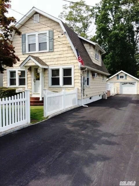 Immaculate Dutch Colonial! 3/4 Bedrms Everything New! Granite Kitchen/Sliders To Trek Deck! Upgraded Energy Efficient Through The Long Island Greens Program! Bright & Open Floor Plan! Full Basement! 220 Amp Upgraded Electric! Front Loader Washer & Dryer! More Closets Then You Can Fill!! Inground Sprinklers! Pvc Fencing! 4 Car+ Driveway With Det 1.5 Garage! Low Taxes!