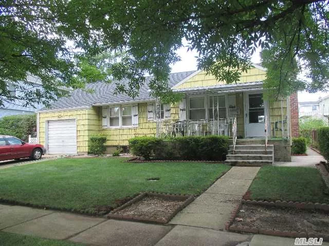 Make This Home Your Way! House Sold As Is. Roof @ 3, Replaced Windows Main Level Hw Floor Under Carpet. Gas Stove, Heated Bsmt, Boiler @ 20. Garage Has Front & Rear Doors. Lovely Front Porch. Near Neighborhood Park! Taxes With Star@ $6, 423.