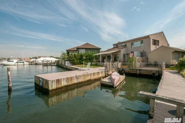 Contemporary Waterfront Home W/45&rsquo;X25&rsquo; Boat Slip, Total 160&rsquo; Of Bulkhead On Wide River For The Boater Who Likes To Entertain. Master Suite W/Clerestory Windows, Skylights, Marble Bath W/Spa Tub & Wic. Rooms Offer Views Of The Bay And Narrasketuck River. Chef&rsquo;s Kitchen W/New Stainless Steel Appl & Wine Cooler. New Heat & Elec. Hardwood Floors. Perched High And Dry!