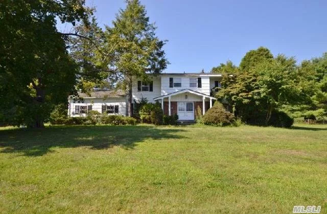 Gorgeous,  Perfectly Flat, Useable 2 Acres Situated In The Village Of Laurel Hollow-  Center Hall Colonial Is Sunny And Spacious W. Large Bedrooms. Ideal For Renovation, Create Your Dream Home. Sold &rsquo;As Is.  Laurel Hollow Beach And Mooring (Fees). Cold Spring Harbor Schools. Incredible Opportunity!