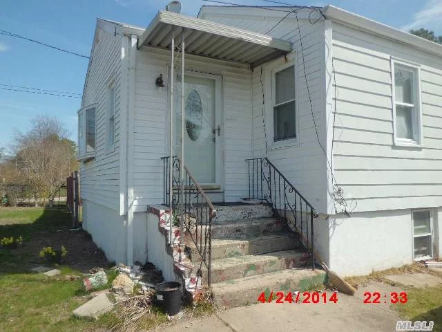 Large Ranch With Large Windows And An Above Ground Basement.House Doese Need Some T.L.C.