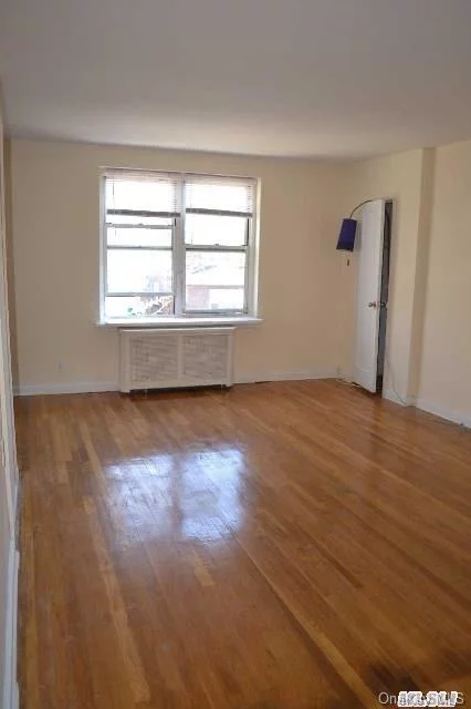 Vacant. Ez To Show! Spacious Upper 2 Bedroom, 1 Bath Coop With Beautiful Hardwood Floors On A Quiet Block With Easy Street Parking. Location, Location, Location. Walking Distance To Lirr, Bus, Shopping. Close To Major Highways. Maintenance Is $825 A Month, $200 For A Garage, There Is A Waiting List. No Flip Tax.