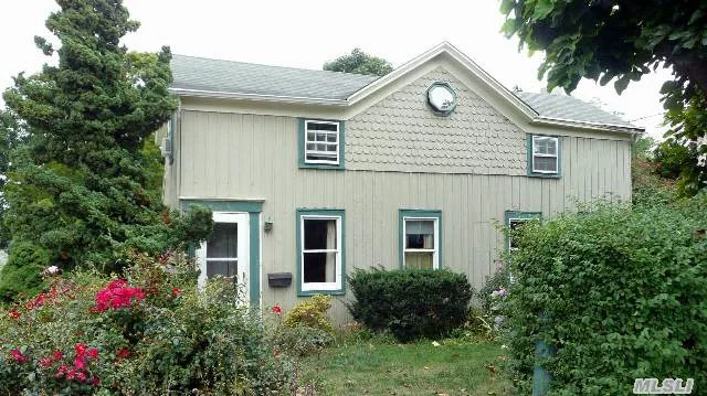 Charming 2 Br Cottage In Heart Of Greenport Maritime Village, Lovely Back Garden. Renovated 1973 House Retains Original Flavor With Board-Batten, Fish Scale Shingles & Small Center Gable Exterior. Walk To Bay Beach, Marinas, All Village Shops, Resturants & Transportation. House & Garden Need A Bit Of Tlc.