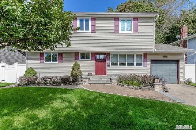 Lovely Colonial In Sd#4 , Features 4 Bedrooms, 2 Full Baths, Hw Floors . Many Updates Include Siding, Windows, Roof, Hw Heater, 200 Amp And More, Igs, Cac, Full Basement, Raised Panel Doors. Wood Deck . Private Yard. Fireplace. Basic Star Is 1197-   Gas On The Street!!  Taxes Being Grieved And We Have Been Told To Expect 10-20% Reduction.