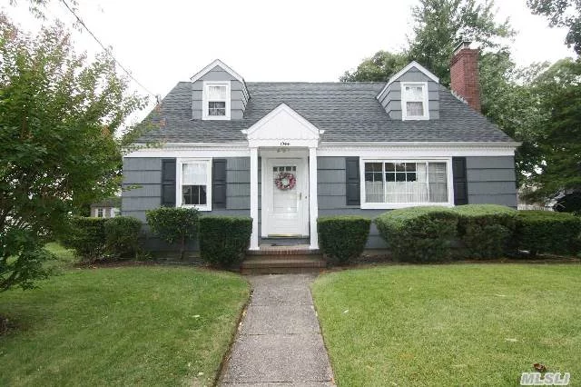 Fantastic Well Maintained 3 Bedroom 2 Bath Cape With Hard Wood Floors, Beautiful Livingroom With Garrison Wood Burning Stove New Siding, Newer Roof New Boiler And Hot Water Tank On A Fantastic Tree Lined Block