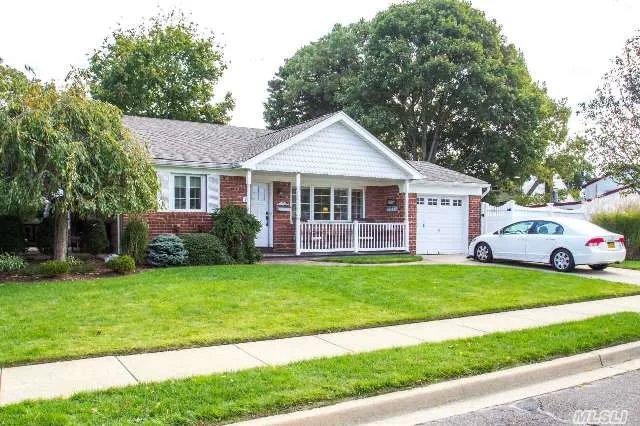 Farmingdale, Split, 2 Baths. This Updated Home Sit On Professionally Landscaped Property Toward The End Of The Cul-De-Sac. Charming Front Porch Entry, Kitchen With Thomasville Cabinetry, Granite Counters, Gas Cooking Range, Stainless Steel Appliances. Dual Patios, Updated Windows & Doors, Vaulted Living Room, Hardwood Floors, Architectural Roof, Vinyl Siding & Pvc Fence.